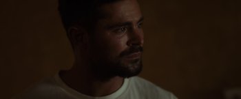 Movie still from “Firestarter” (2022), directed by Keith Thomas – A person wearing a white shirt; Close Up shot, Over the shoulder angle