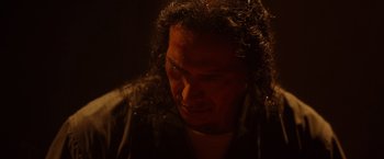 Movie still from “Firestarter” (2022), directed by Keith Thomas – A person with curly hair; Close Up shot, Low angle