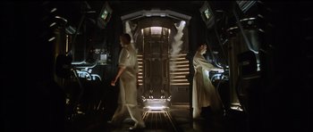 Movie still from “Alien: Resurrection” (1997), directed by Jean-Pierre Jeunet – Two men in white are standing in a room; Wide shot, Low angle