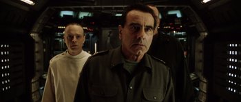 Movie still from “Alien: Resurrection” (1997), directed by Jean-Pierre Jeunet – A group of men standing next to each other in a room; Close Up shot, Low angle