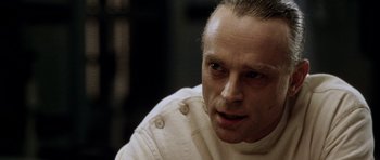 Movie still from “Alien: Resurrection” (1997), directed by Jean-Pierre Jeunet – A person wearing a white shirt; Close Up shot, Over the shoulder angle