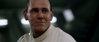 Movie still from “Alien: Resurrection” (1997), directed by Jean-Pierre Jeunet – A person wearing a white shirt; Close Up shot, Low angle