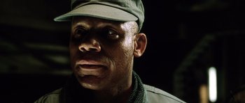 Movie still from “Alien: Resurrection” (1997), directed by Jean-Pierre Jeunet – A person wearing a hat; Close Up shot, Low angle