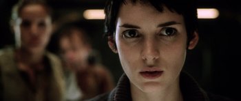 Movie still from “Alien: Resurrection” (1997), directed by Jean-Pierre Jeunet – A person with short hair; Close Up shot, Low angle