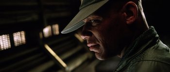 Movie still from “Alien: Resurrection” (1997), directed by Jean-Pierre Jeunet – A person wearing a hat; Close Up shot, Low angle