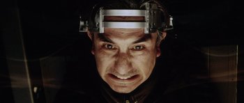 Movie still from “Alien: Resurrection” (1997), directed by Jean-Pierre Jeunet – A person wearing a head piece; Close Up shot, Low angle