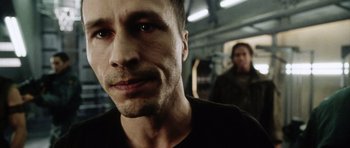 Movie still from “Alien: Resurrection” (1997), directed by Jean-Pierre Jeunet – A person looking at the camera; Close Up shot, Low angle