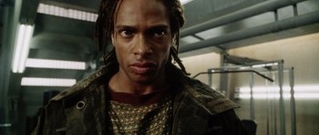 Movie still from “Alien: Resurrection” (1997), directed by Jean-Pierre Jeunet – A person with dreads; Close Up shot, Low angle