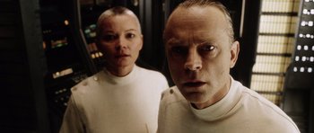 Movie still from “Alien: Resurrection” (1997), directed by Jean-Pierre Jeunet – A man and a woman standing next to each other; Close Up shot, Low angle
