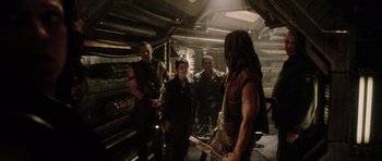 Movie still from “Alien: Resurrection” (1997), directed by Jean-Pierre Jeunet – A group of people standing around in a room; Wide shot, High angle