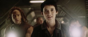Movie still from “Alien: Resurrection” (1997), directed by Jean-Pierre Jeunet – A person with short hair; Close Up shot, Over the shoulder angle