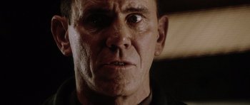 Movie still from “Alien: Resurrection” (1997), directed by Jean-Pierre Jeunet – An old man with an angry look on his face; Close Up shot, Low angle