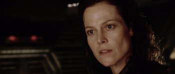 Movie still from “Alien: Resurrection” (1997), directed by Jean-Pierre Jeunet – A woman's face in the dark; Close Up shot, Low angle