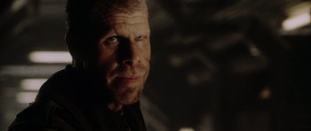 Movie still from “Alien: Resurrection” (1997), directed by Jean-Pierre Jeunet – A person wearing a black shirt; Close Up shot, Over the shoulder angle