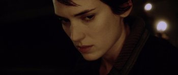 Movie still from “Alien: Resurrection” (1997), directed by Jean-Pierre Jeunet – A person with short dark hair; Close Up shot, Over the shoulder angle