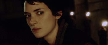 Movie still from “Alien: Resurrection” (1997), directed by Jean-Pierre Jeunet – A person with a light in the background; Close Up shot, Over the shoulder angle