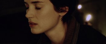 Movie still from “Alien: Resurrection” (1997), directed by Jean-Pierre Jeunet – A woman's face with her eyes closed; Close Up shot, High angle