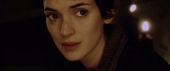 Movie still from “Alien: Resurrection” (1997), directed by Jean-Pierre Jeunet – A woman's face in the dark; Close Up shot, Over the shoulder angle