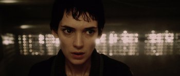 Movie still from “Alien: Resurrection” (1997), directed by Jean-Pierre Jeunet – A person with a blurry background; Close Up shot, Low angle