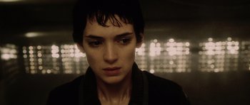 Movie still from “Alien: Resurrection” (1997), directed by Jean-Pierre Jeunet – A man with wet hair is looking into the camera; Close Up shot, Low angle