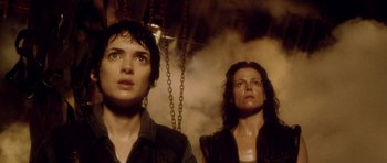 Movie still from “Alien: Resurrection” (1997), directed by Jean-Pierre Jeunet – A man and a woman standing next to each other; Close Up shot, Low angle