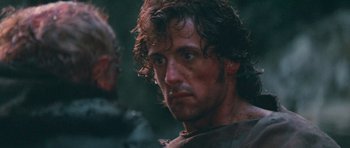 Movie still from “First Blood” (1982), directed by Ted Kotcheff – A person with a beard; Close Up shot, Over the shoulder angle