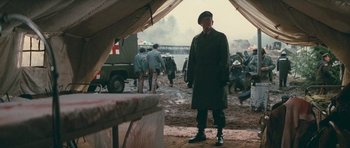 Movie still from “First Blood” (1982), directed by Ted Kotcheff – An old man in a military uniform standing in front of an army tent; Wide shot, Low angle
