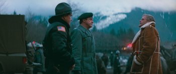 Movie still from “First Blood” (1982), directed by Ted Kotcheff – A couple of men standing next to each other; Medium shot, Over the shoulder angle