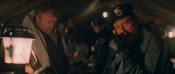 Movie still from “First Blood” (1982), directed by Ted Kotcheff – A group of men standing next to each other; Close Up shot, Low angle