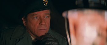 Movie still from “First Blood” (1982), directed by Ted Kotcheff – A person wearing a hat; Close Up shot, Over the shoulder angle