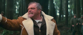 Movie still from “First Blood” (1982), directed by Ted Kotcheff – An older man in a shearling jacket with a snarling face; Close Up shot, Low angle
