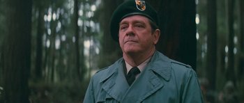 Movie still from “First Blood” (1982), directed by Ted Kotcheff – An older man in a green military uniform; Close Up shot, Low angle