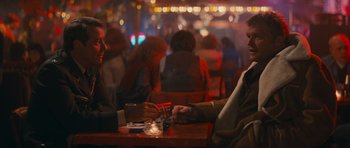 Movie still from “First Blood” (1982), directed by Ted Kotcheff – Two men sitting at a table in a restaurant; Medium shot, Over the shoulder angle