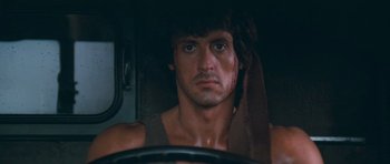 Movie still from “First Blood” (1982), directed by Ted Kotcheff – Sylvester stallone in a scene from the movie rambo; Close Up shot, Over the shoulder angle