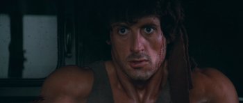 Movie still from “First Blood” (1982), directed by Ted Kotcheff – Sylvester stallone in a scene from the movie rambo; Close Up shot, Low angle