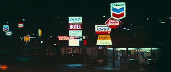 Movie still from “First Blood” (1982), directed by Ted Kotcheff – A bunch of signs on the side of the road; Extreme Wide shot, High angle
