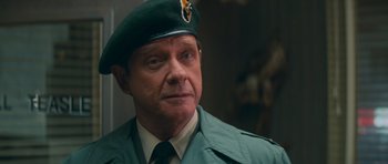 Movie still from “First Blood” (1982), directed by Ted Kotcheff – A person wearing a uniform; Close Up shot, Over the shoulder angle