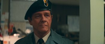 Movie still from “First Blood” (1982), directed by Ted Kotcheff – A person wearing a uniform; Close Up shot, Over the shoulder angle