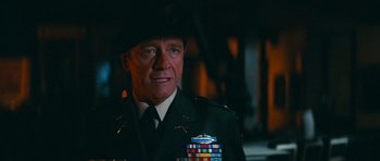 Movie still from “First Blood” (1982), directed by Ted Kotcheff – A person wearing a uniform; Close Up shot, Over the shoulder angle