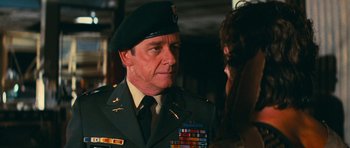 Movie still from “First Blood” (1982), directed by Ted Kotcheff – A man in a military uniform is talking to a woman; Close Up shot, Over the shoulder angle