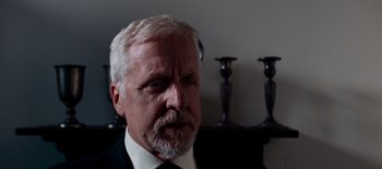 Movie still from “First Reformed” (2017), directed by Paul Schrader – An older man wearing a suit and tie; Close Up shot, Low angle