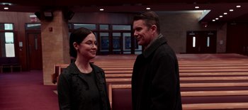 Movie still from “First Reformed” (2017), directed by Paul Schrader – A man and a woman standing next to each other; Medium shot, Over the shoulder angle