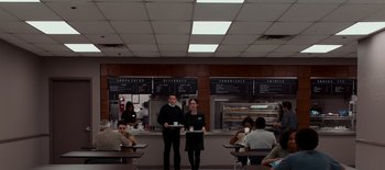 Movie still from “First Reformed” (2017), directed by Paul Schrader – A couple of people that are in a restaurant; Wide shot, High angle