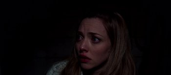 Movie still from “First Reformed” (2017), directed by Paul Schrader – A person with a sad look on their face; Close Up shot, High angle