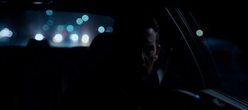 Movie still from “First Reformed” (2017), directed by Paul Schrader – A man sitting in the back seat of a car at night; Close Up shot, Over the shoulder angle