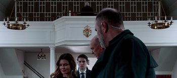 Movie still from “First Reformed” (2017), directed by Paul Schrader – A group of people standing in front of a building; Close Up shot, Low angle