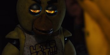 Movie still from “Five Nights at Freddy's” (2023), directed by Emma Tammi – The eyes of a stuffed animal; Close Up shot, Over the shoulder angle