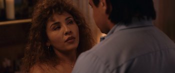 Movie still from “Flamin' Hot” (2023), directed by Eva Longoria – A woman with curly hair and a man in a blue shirt; Close Up shot, Over the shoulder angle