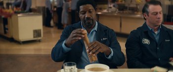 Movie still from “Flamin' Hot” (2023), directed by Eva Longoria – A man sitting at a table with a bowl of soup; Close Up shot, Over the shoulder angle