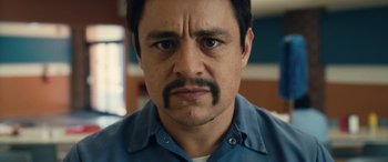 Movie still from “Flamin' Hot” (2023), directed by Eva Longoria – A person with a mustache; Close Up shot, Low angle